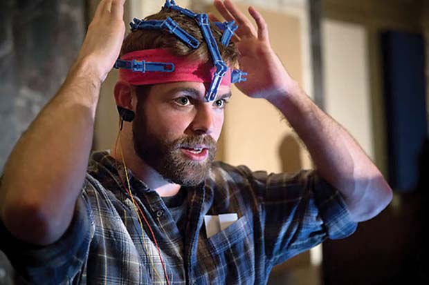 Conor wears an early prototype of the OpenBCI 3D-printable EEG Headset.